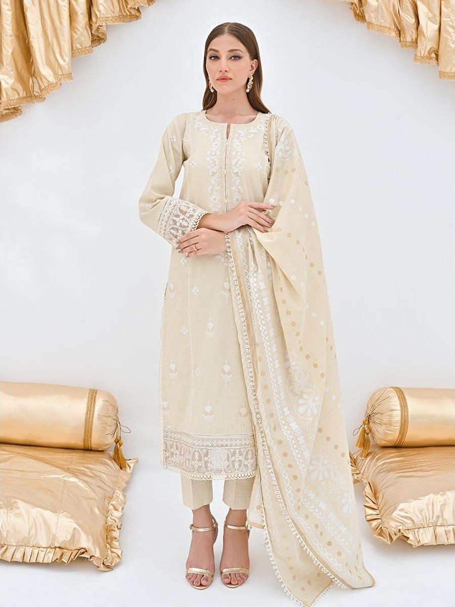 Unstitched suit set crafted in dobby fabric features a handcrafted Kalamkari printed patch.
